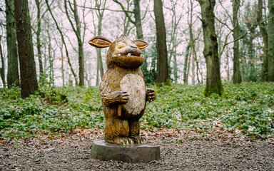 A carved Gruffalo character sculpture