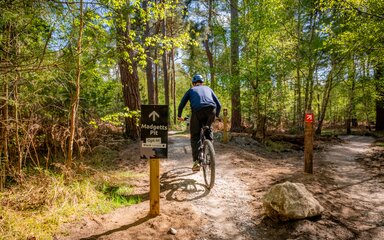 Cyclists rides towards madgetts pit