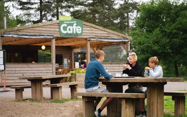 A family eating lunch outside a cafe