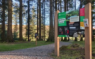 Welcome sign at accessible path