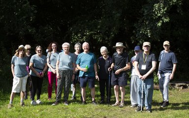 Group of people standing on grass