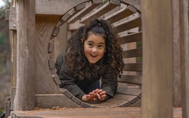 Child playing in a tunnel