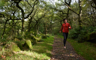 Woman running in the woods