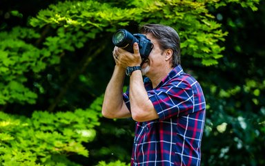 Man taking a photo with camera