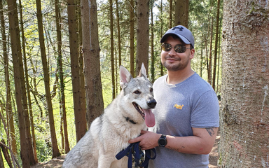 Man with dog in the forest