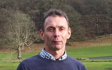 Headshot of Kevin May