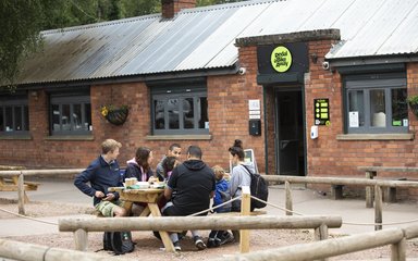 Family sitting outside cafe