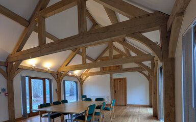 interior of an oak framed building showing rafters