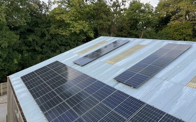 solar panel on roof in woodland setting