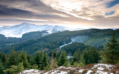 Whinlatter mountains covered in snow at sunset 