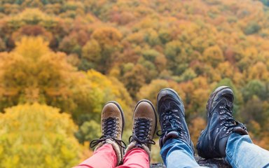 Feet against a colourful autumn backdrop