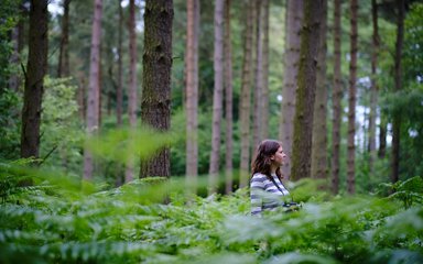 Tiffany Francis stood in waste high forest greenery