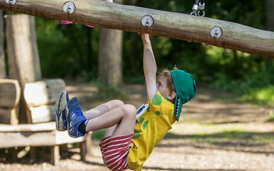 Child playing on Timberline play structure