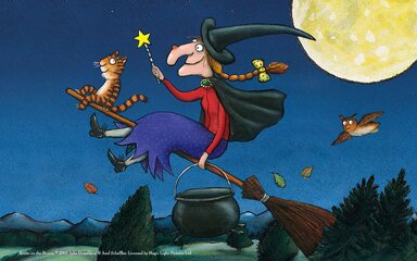 Illustration of a witch and a cat flying on a broomstick across the night sky.