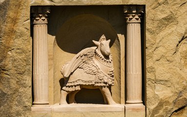 A stone carving of the Winged Sheep by Fiona Bowley