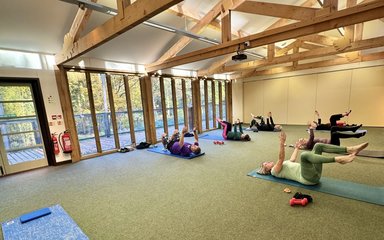 A group of people taking part in a pilates class