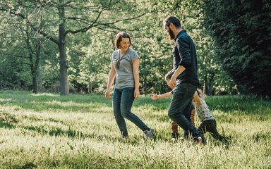 Family walking in Wyre Forest Arboretum in summer