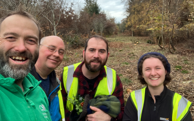 a group of smiling forestry volunteers