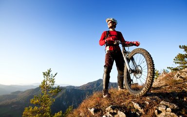 Mountain biker at the top of a forest trail