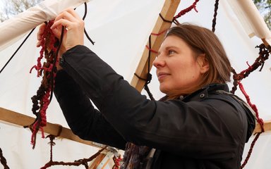 Artist Debs tying rope to Lungs of the Earth installation