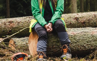 Worker sat on log