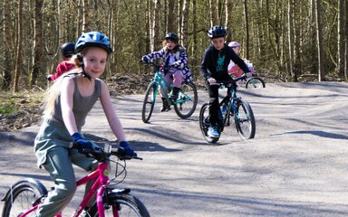 Children riding bikes on Pedal and Play Mountain bike trail