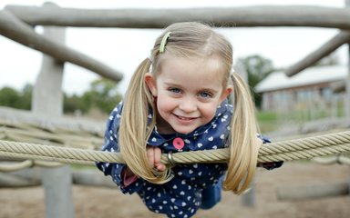 girl on a swing in a playground