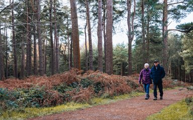 couple walk along walking trail