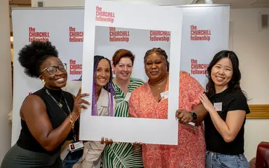 Five women standing around an image border for the churchill fellowhip.