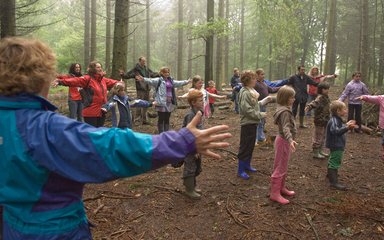 School children learning in the open forest