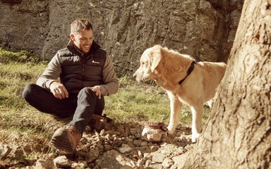 Man sitting on the floor with dog