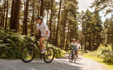 Three young people cycling