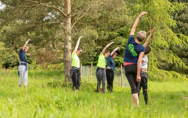 Bedgebury Forest Runners stretching in spring