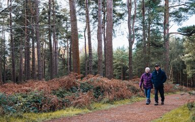 couple walk along walking trail