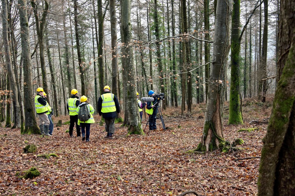 Camera crew filming in the forest