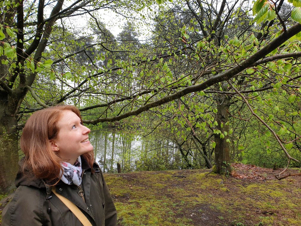 Woman in forest smiling