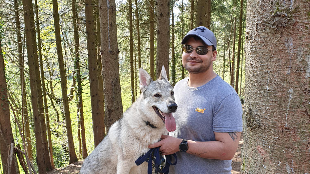 Man with dog in the forest