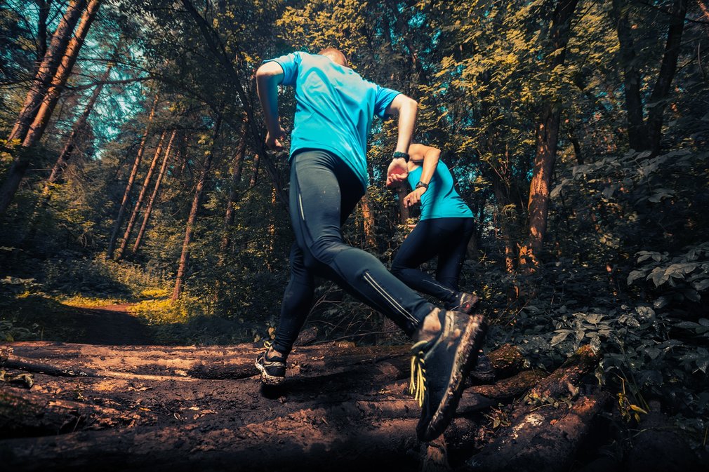 trail runner in forest