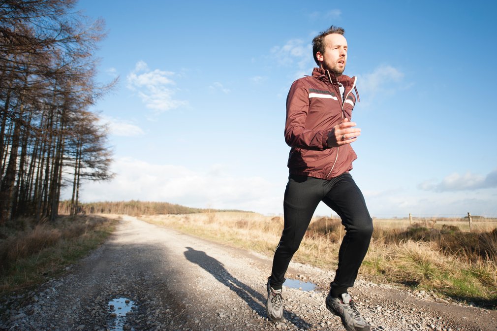Runner on forest road in Stainburn Forest