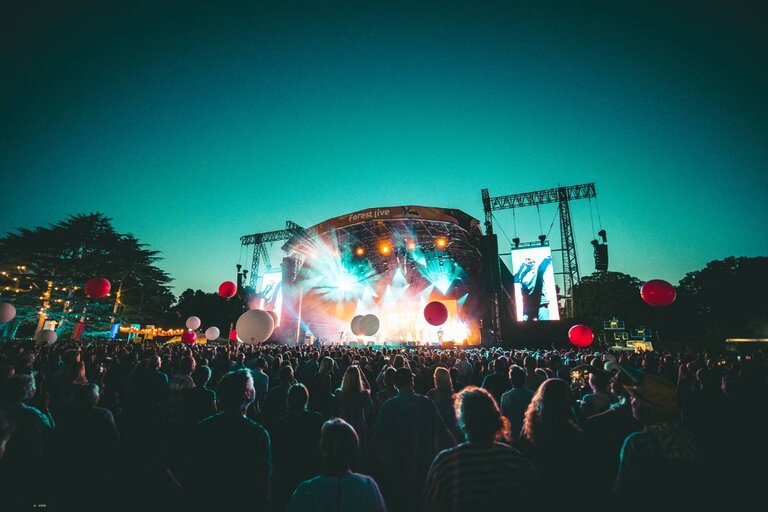 The stage full of balloons during a concert