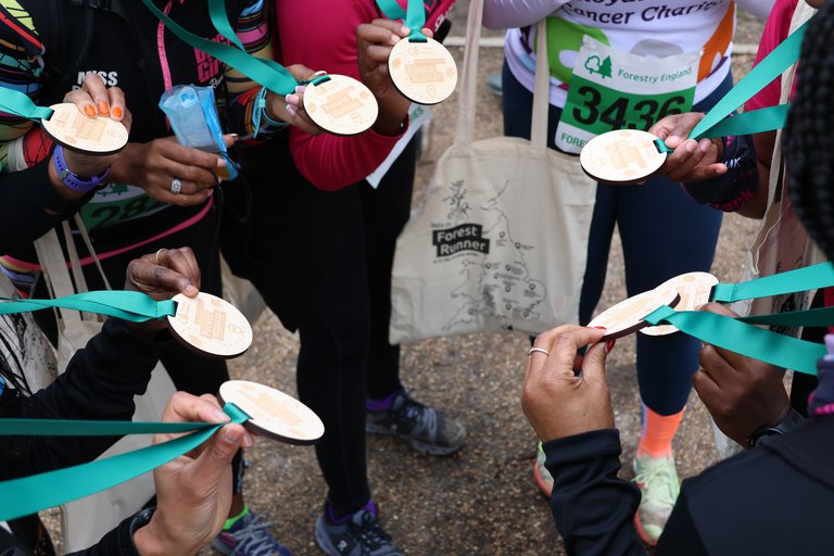group showing medals from run event