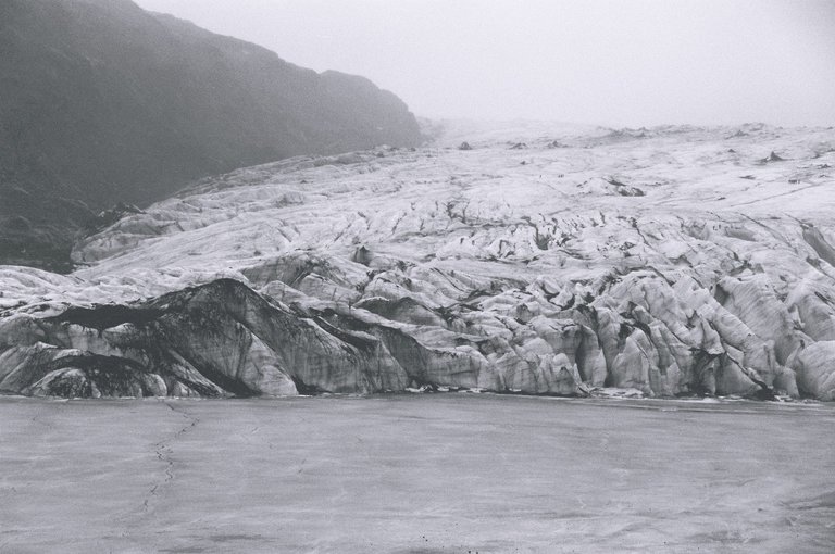Black and white photo of melting glacier