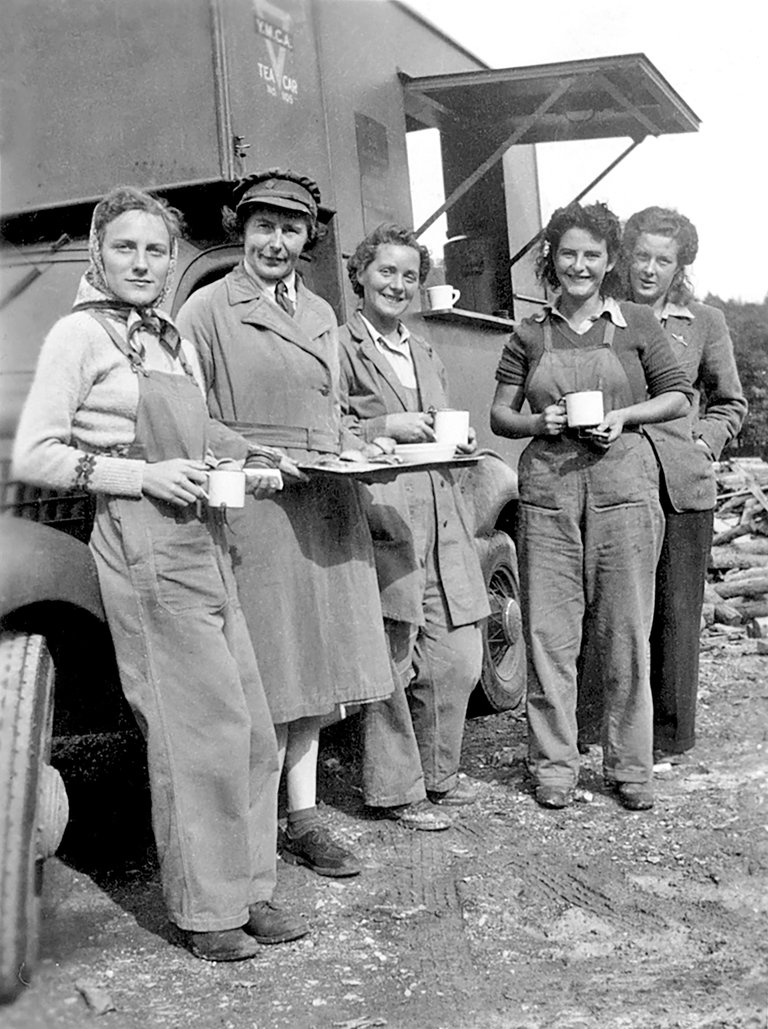 Black and white photo of female timber workers having a cup of tea