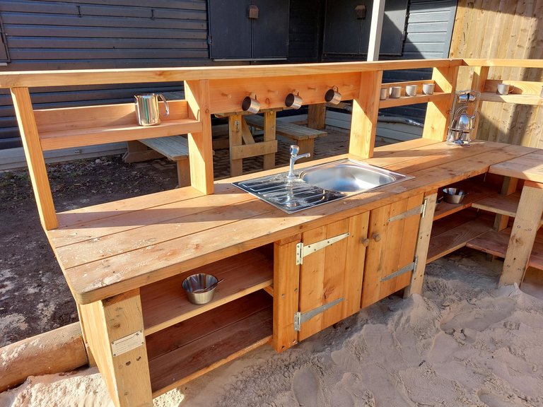 Close-up of wooden mud kitchen at Salcey Forest