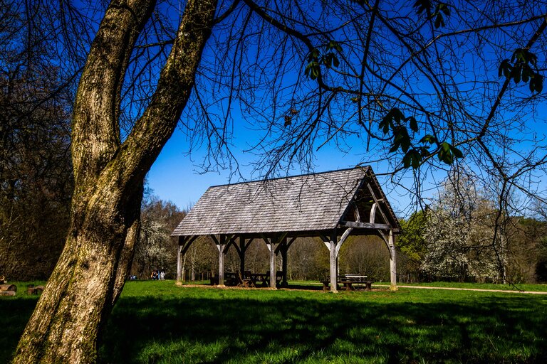Silk Wood Barn - an open sided barn in a grassy opening