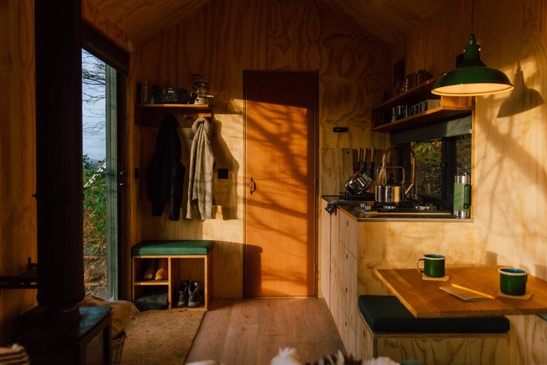 Unyoked cabin interior living area and kitchen